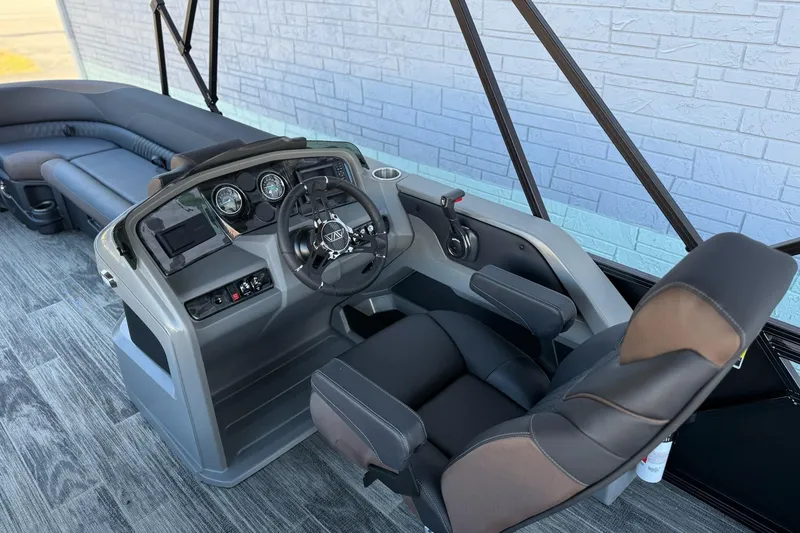 Slide: The Image of 2026 Avalon 2585 LSZ Entertainer boat interior with modern helm and seating. - 12
