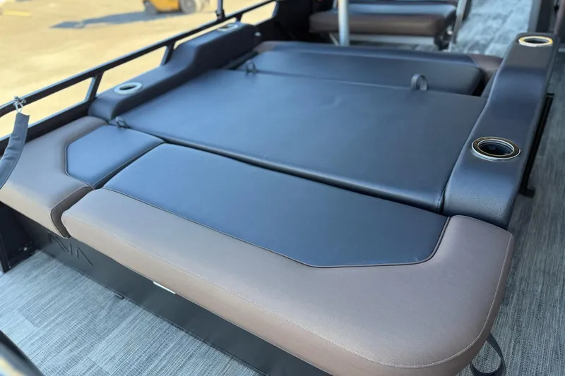 Slide: The Image of 2026 Avalon 2585 LSZ Entertainer boat seating with cup holders, gray and brown upholstery. - 9