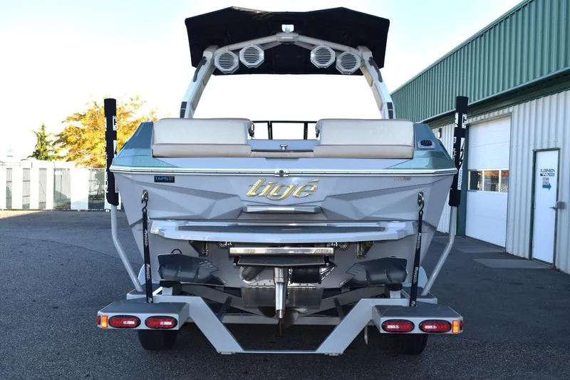 Slide: The Image of 2026 Tigé Z3 boat rear view, showcasing sleek design and advanced features. - 11