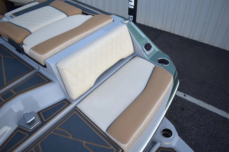 Slide: The Image of 2026 Tigé Z3 boat interior with beige and tan cushioned seating. - 21