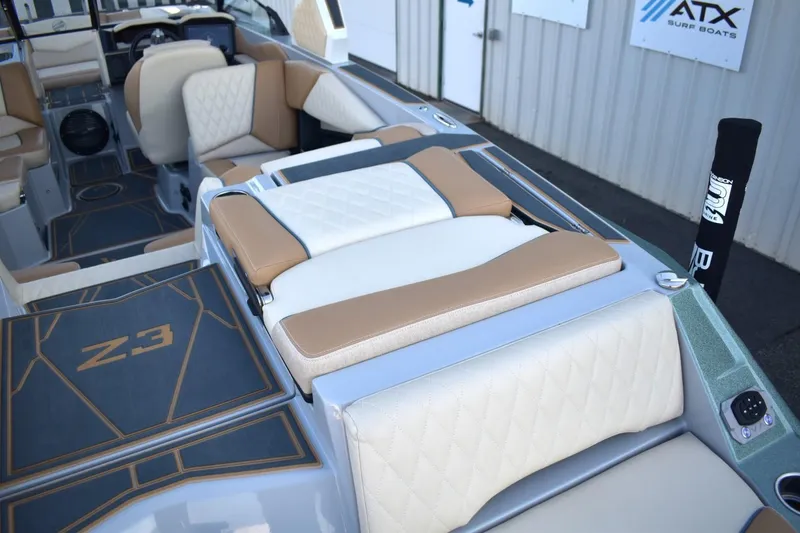 Slide: The Image of 2026 Tigé Z3 boat interior with tan and white seating, featuring modern design elements. - 24