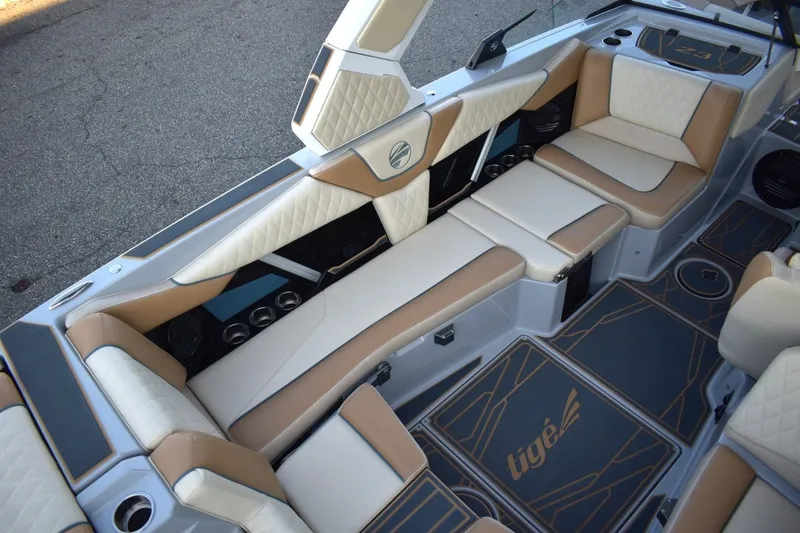 Slide: The Image of 2026 Tigé Z3 boat interior with luxurious tan and white seating, stylish design. - 33