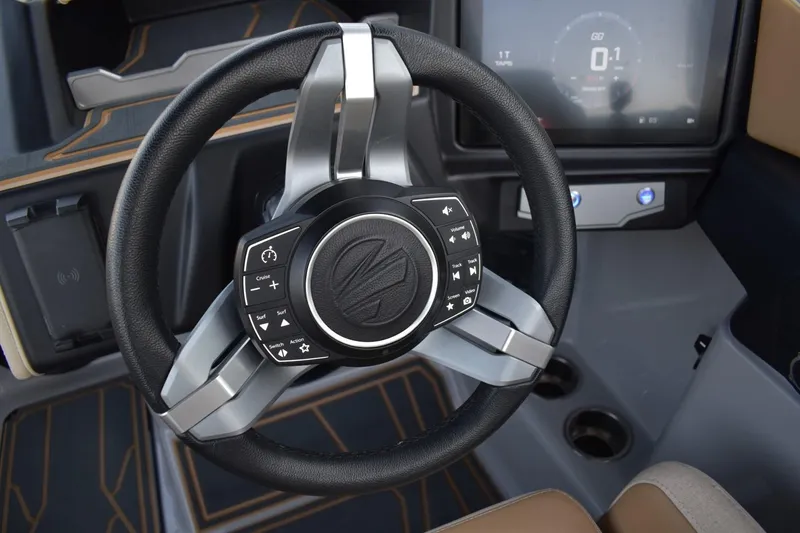 Slide: The Image of Steering wheel of 2026 Tigé Z3 boat with control buttons and digital display. - 35