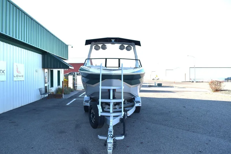 Slide: The Image of 2026 Tigé Z3 boat on trailer outside a dealership, front view. - 4