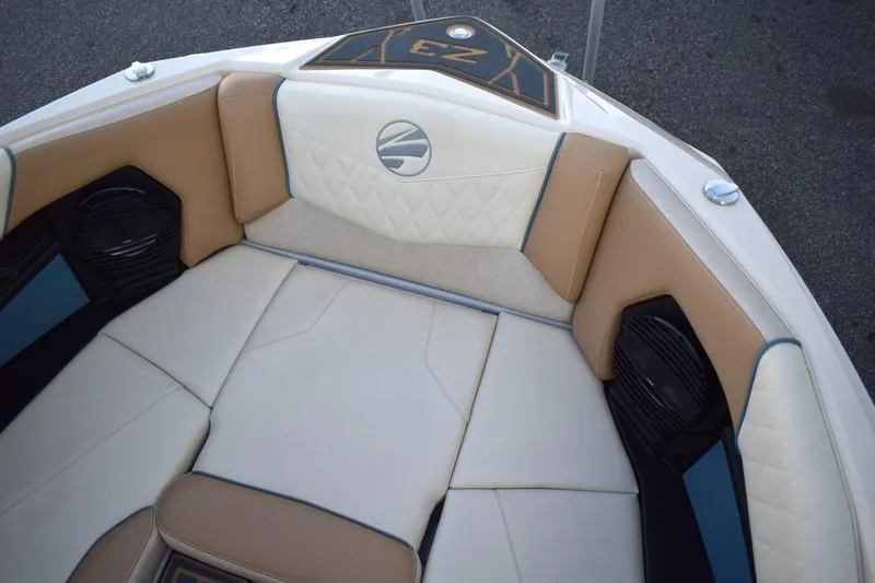 Slide: The Image of 2026 Tigé Z3 boat interior with beige and cream seating, featuring diamond stitching and speakers. - 42