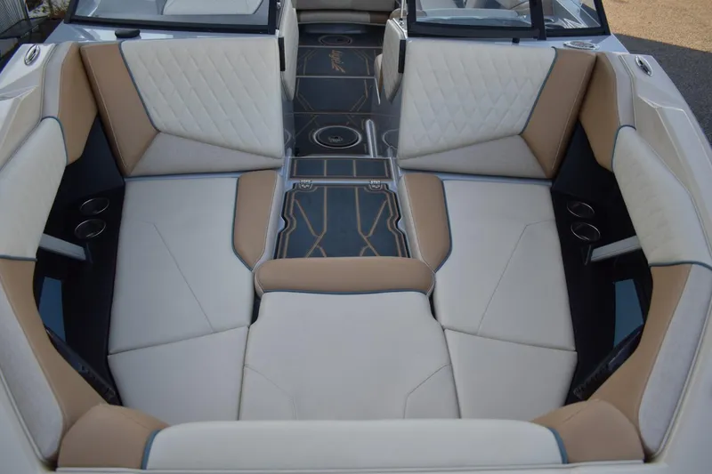 Slide: The Image of 2026 Tigé Z3 boat interior with luxurious beige and white seating, featuring cup holders. - 44