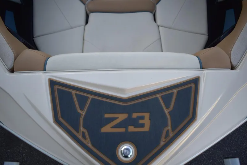 Slide: The Image of 2026 Tigé Z3 boat interior with beige and white seating, featuring Z3 logo. - 45