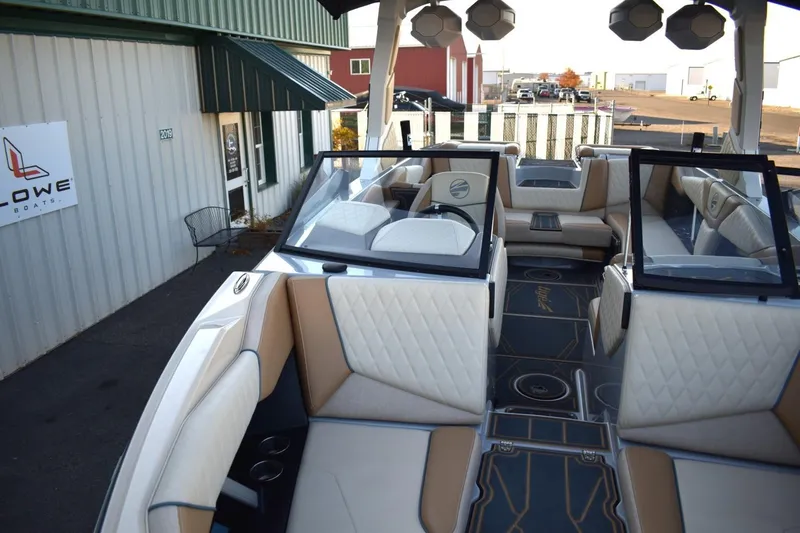 Slide: The Image of 2026 Tigé Z3 boat interior with luxurious seating and modern design at a dealership. - 46