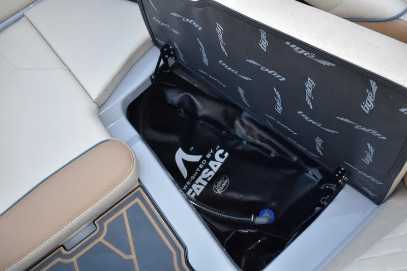 Slide: The Image of 2026 Tigé Z3 boat interior with storage compartment and ballast bag. - 48