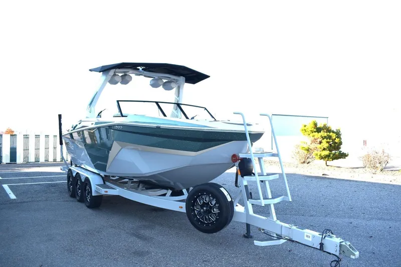 Slide: The Image of 2026 Tigé Z3 boat on trailer, parked outdoors, showcasing sleek design and modern features. - 5