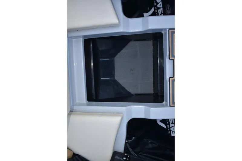 Slide: The Image of 2026 Tigé Z3 boat interior storage compartment, featuring sleek design and white cushioning. - 50