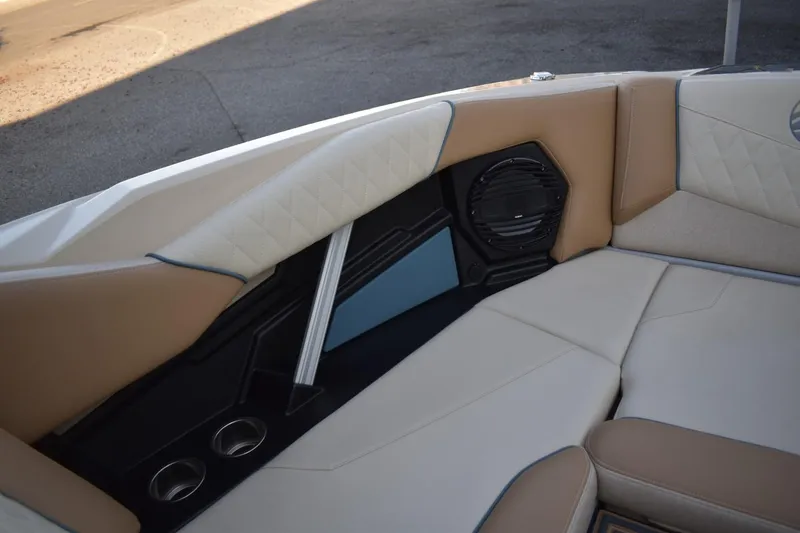 Slide: The Image of 2026 Tigé Z3 boat interior with beige seating, speaker, and cup holders. - 51
