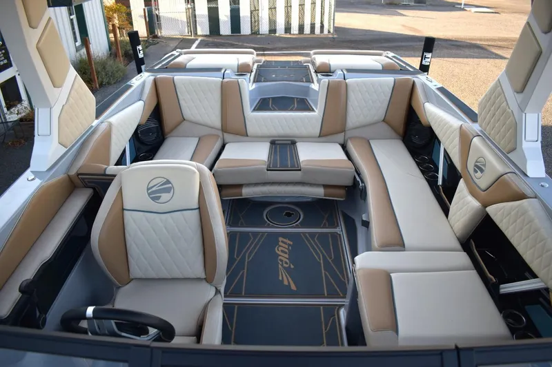 Slide: The Image of Luxurious interior of 2026 Tigé Z3 boat with beige and white seating. - 54