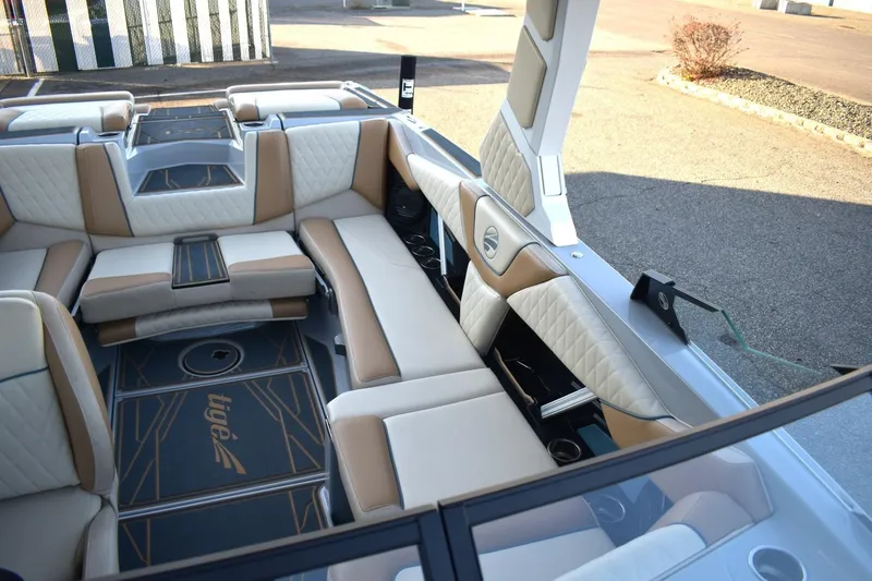 Slide: The Image of Luxurious interior of 2026 Tigé Z3 boat with beige and white seating. - 55