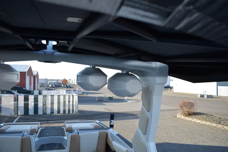 Slide: The Image of 2026 Tigé Z3 boat interior with speakers and seating, parked outdoors. - 58