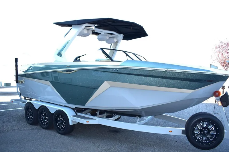 Slide: The Image of 2026 Tigé Z3 boat on trailer, sleek design, modern features, parked outdoors. - 6