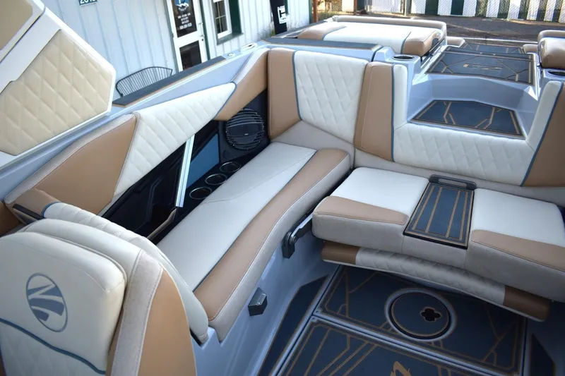 Slide: The Image of Luxurious interior of 2026 Tigé Z3 boat with tan and white seating. - 61