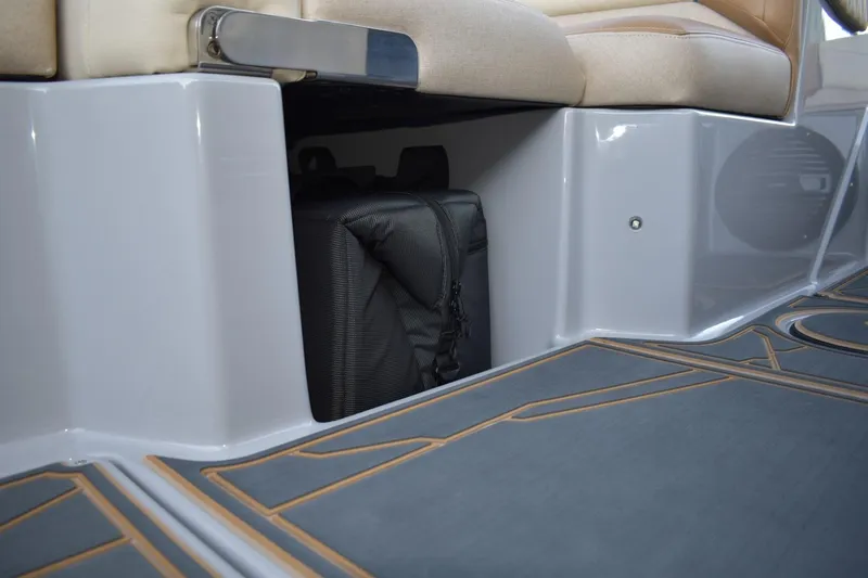Slide: The Image of 2026 Tigé Z3 boat interior storage compartment with a black bag. - 62