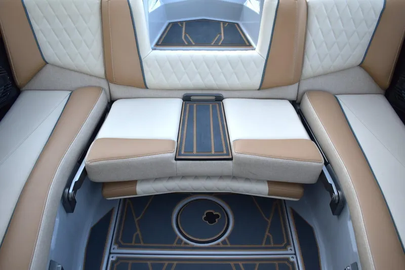 Slide: The Image of 2026 Tigé Z3 boat interior with luxurious tan and white seating, featuring quilted upholstery. - 67