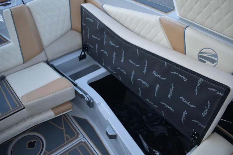 Slide: The Image of 2026 Tigé Z3 boat interior with open storage compartment and cushioned seating. - 69