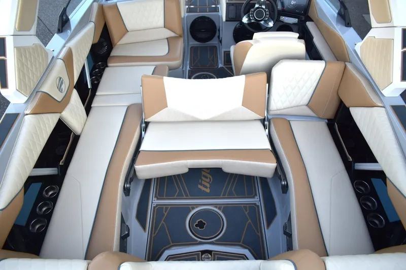Slide: The Image of Luxurious interior of 2026 Tigé Z3 boat with beige and white seating. - 72