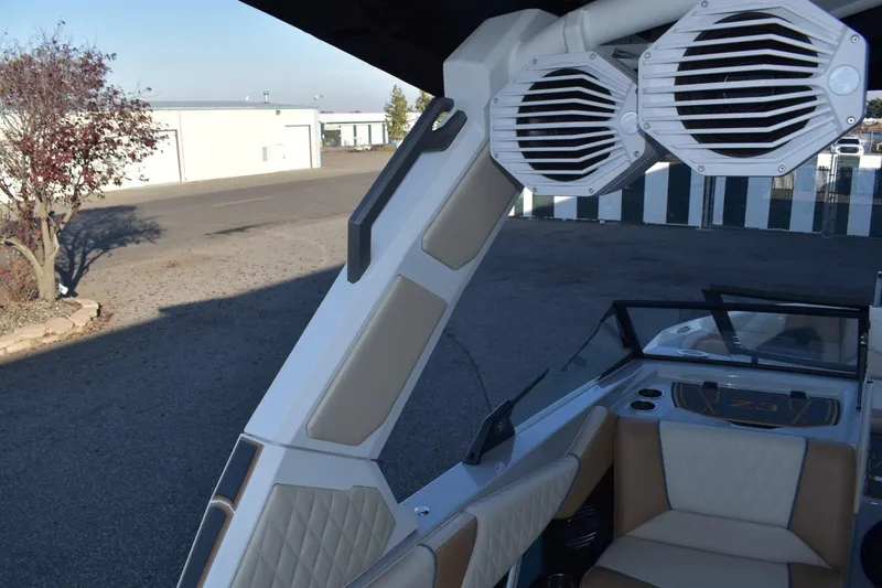 Slide: The Image of 2026 Tigé Z3 boat interior with speakers and seating, showcasing modern design features. - 77