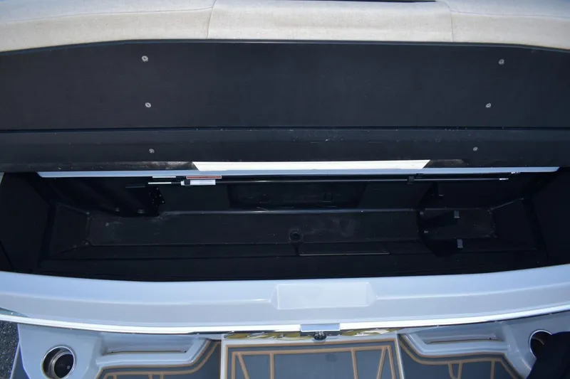 Slide: The Image of 2026 Tigé Z3 boat storage compartment, open and empty, showcasing interior space. - 79