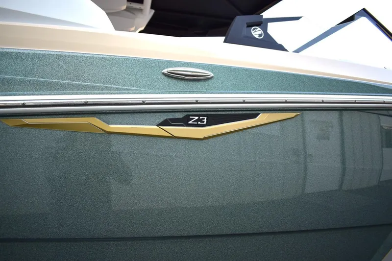 Slide: The Image of 2026 Tigé Z3 boat side view with sleek design and metallic finish. - 8
