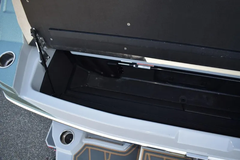 Slide: The Image of Open storage compartment in 2026 Tigé Z3 boat, showcasing interior space and design. - 80