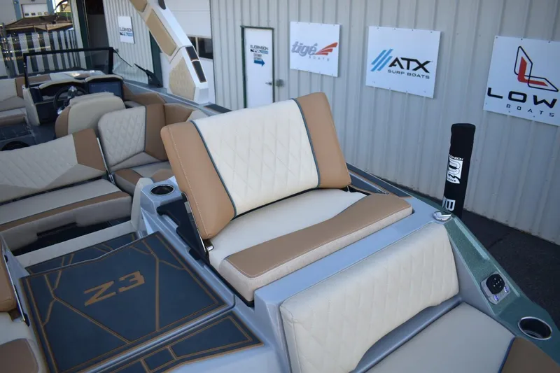 Slide: The Image of 2026 Tigé Z3 boat interior with beige and tan seating, showcasing luxury design. - 83