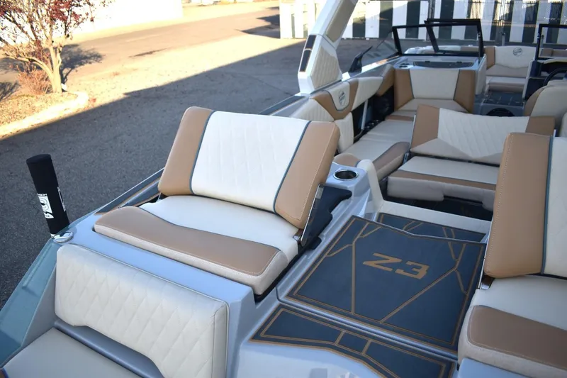 Slide: The Image of 2026 Tigé Z3 boat interior with tan and white seating, featuring modern design elements. - 84