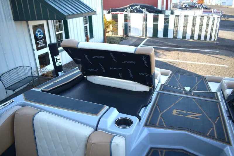 Slide: The Image of 2026 Tigé Z3 boat interior with open storage compartment and stylish seating. - 85