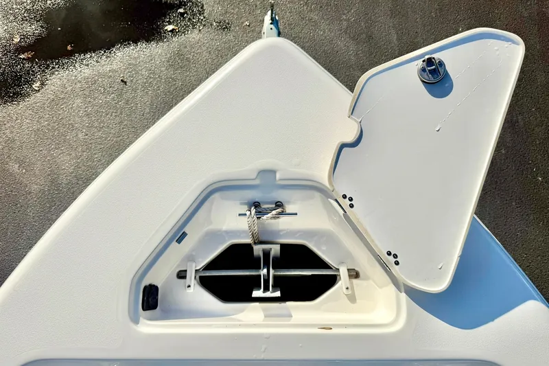 Slide: The Image of Bow storage compartment of 2023 Key West 189 FS boat, open lid, top view. - 14