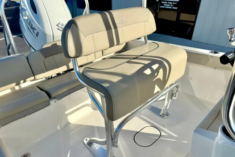 Slide: The Image of 2023 Key West 189 FS boat interior with beige seating and Suzuki engine. - 24