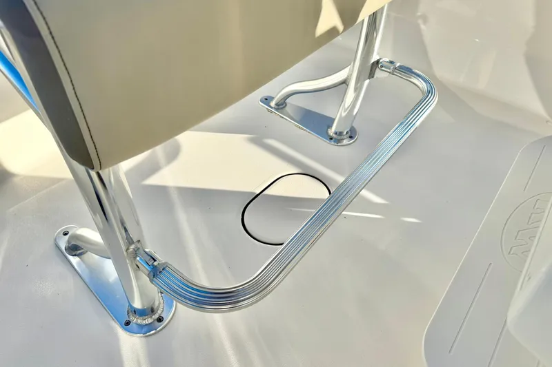 Slide: The Image of 2023 Key West 189 FS boat interior with chrome footrest and seat detail. - 25