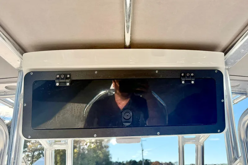 Slide: The Image of 2023 Key West 189 FS boat console with reflective black panel and sturdy metal frame. - 27