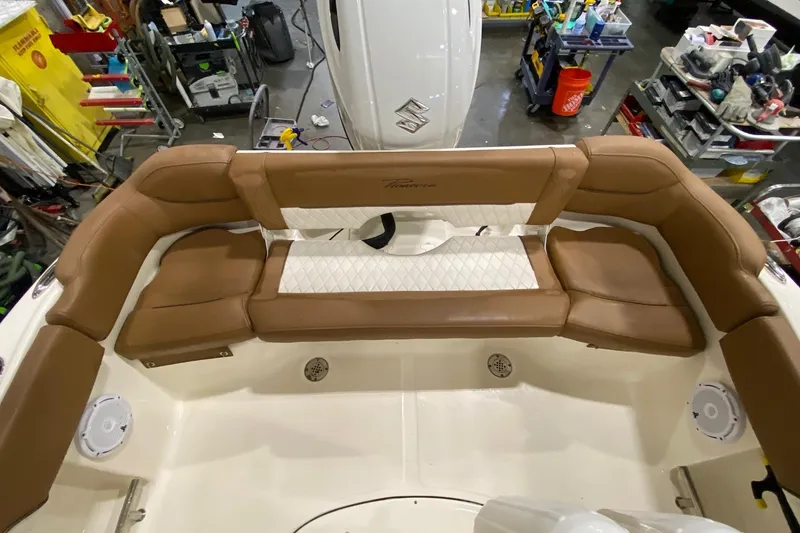 Slide: The Image of 2024 Pioneer 202 Islander boat on trailer in indoor storage facility. - 18