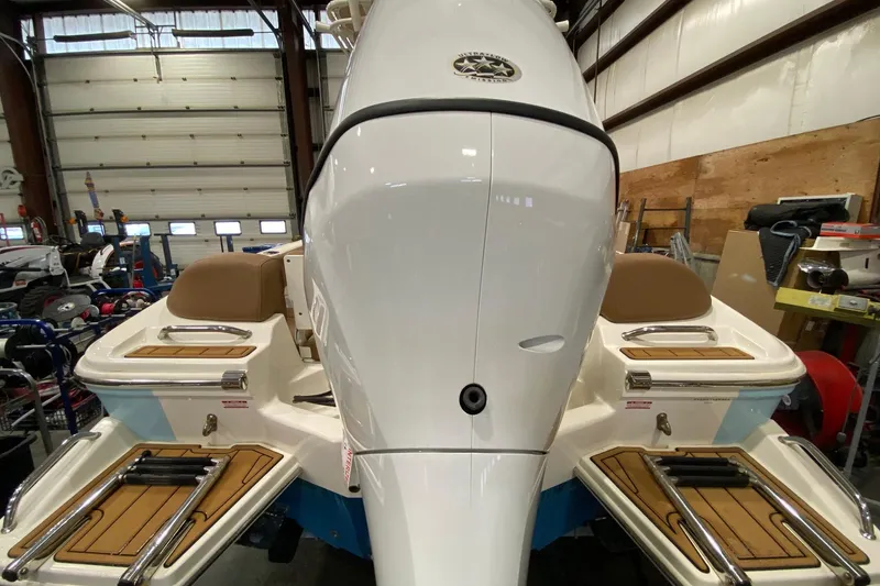 Slide: The Image of 2024 Pioneer 202 Islander boat dashboard with gauges, Simrad display, and JL Audio system. - 6