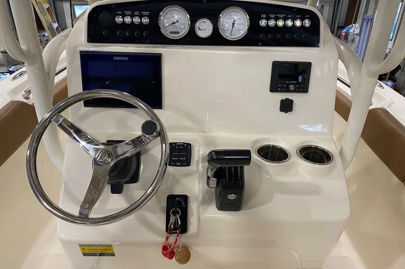 Slide: The Image of 2024 Pioneer 202 Islander boat interior with brown and white seating. - 7