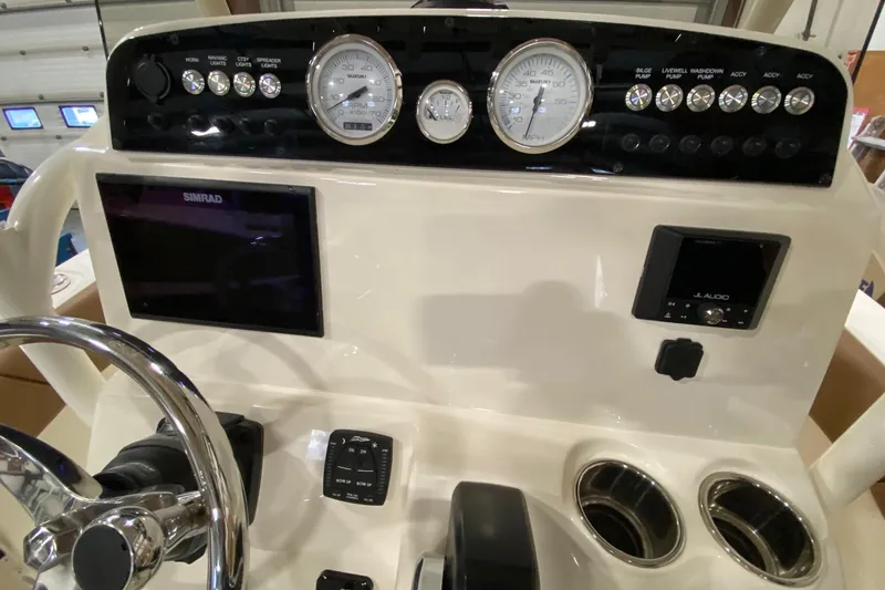 Slide: The Image of 2024 Pioneer 202 Islander boat seat with brown and white diamond-pattern upholstery. - 8