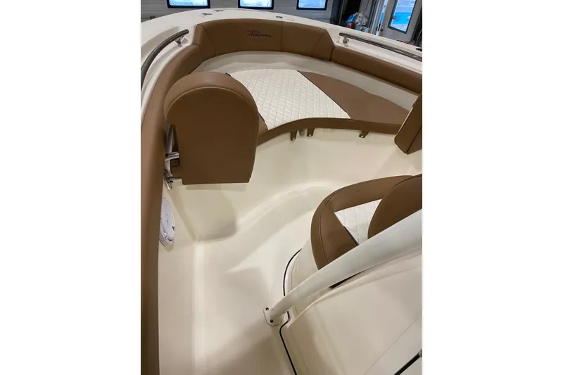 Slide: The Image of 2024 Pioneer 202 Islander boat interior with seating and storage compartments. - 9