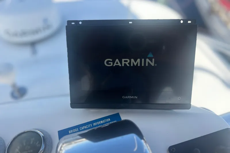 Slide: The Image of Garmin display on 2004 Luhrs 32 Open boat dashboard with bridge capacity information. - 10