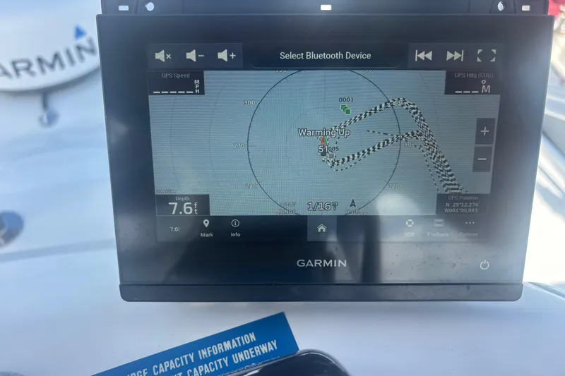 Slide: The Image of Garmin marine GPS display on 2004 Luhrs 32 Open boat, showing navigation data. - 11