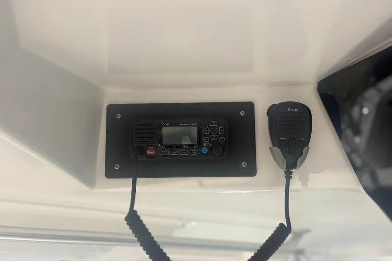 Slide: The Image of ICOM radio system on a 2004 Luhrs 32 Open boat dashboard. - 21