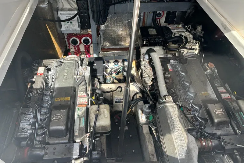 Slide: The Image of Engine room of a 2004 Luhrs 32 Open boat, featuring dual Yanmar engines. - 30