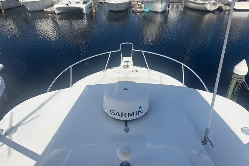 Slide: The Image of 2004 Luhrs 32 Open boat with Garmin equipment, docked in a marina. - 5