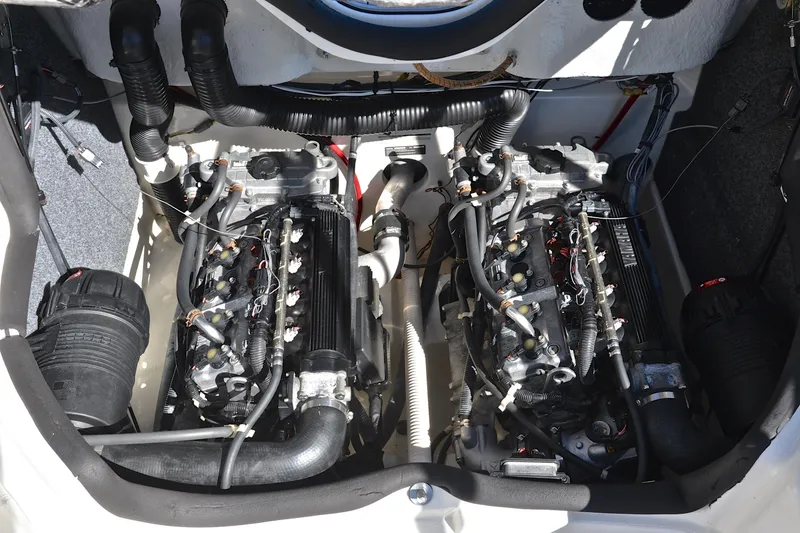 Slide: The Image of Engine compartment of a 2008 Yamaha AR210 boat, showcasing dual engines and components. - 28