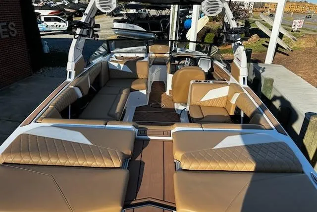 Slide: The Image of 2023 Tigé Z3 boat interior with luxurious tan seating and modern design. - 8