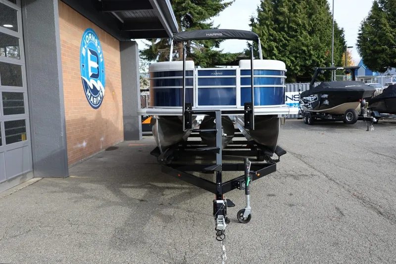 Slide: The Image of 2026 Harris CRUISER 230 SL pontoon boat on trailer at Bjornson Marine dealership. - 11