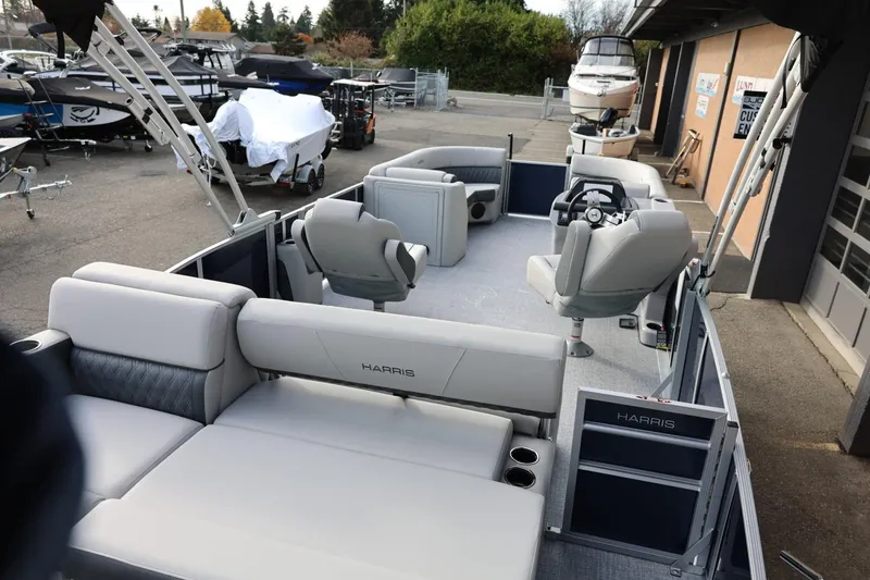 Slide: The Image of 2026 Harris CRUISER 230 SL pontoon boat with spacious seating and modern design. - 15